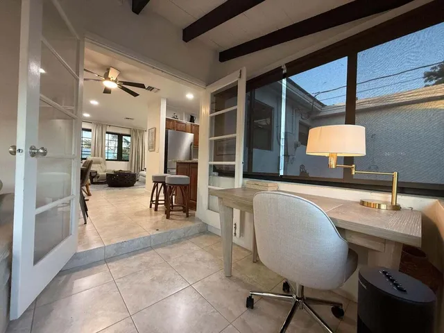 a lobby with furniture and a chandelier