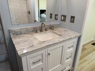 102 Ledford Chapel Road Hayesville, NC 28904 - Photo 15 of 30 a bathroom with a granite countertop sink and a mirror