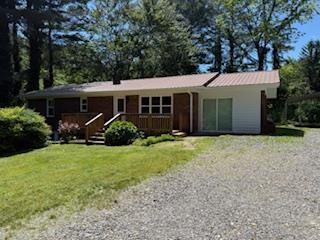 102 Ledford Chapel Road Hayesville, NC 28904 - Photo 26 of 30 a view of a house with backyard and garden