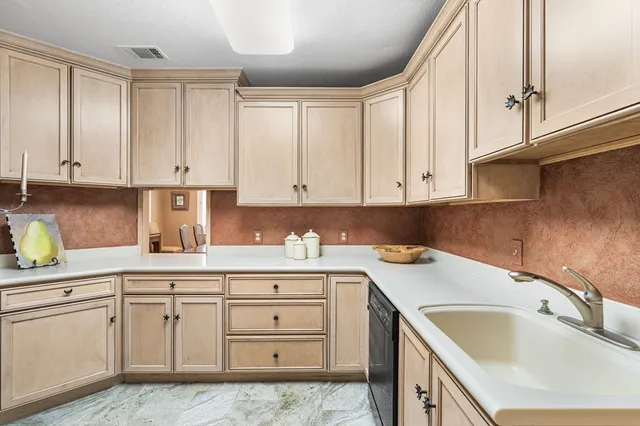 a living room with furniture and a dining table with wooden floor