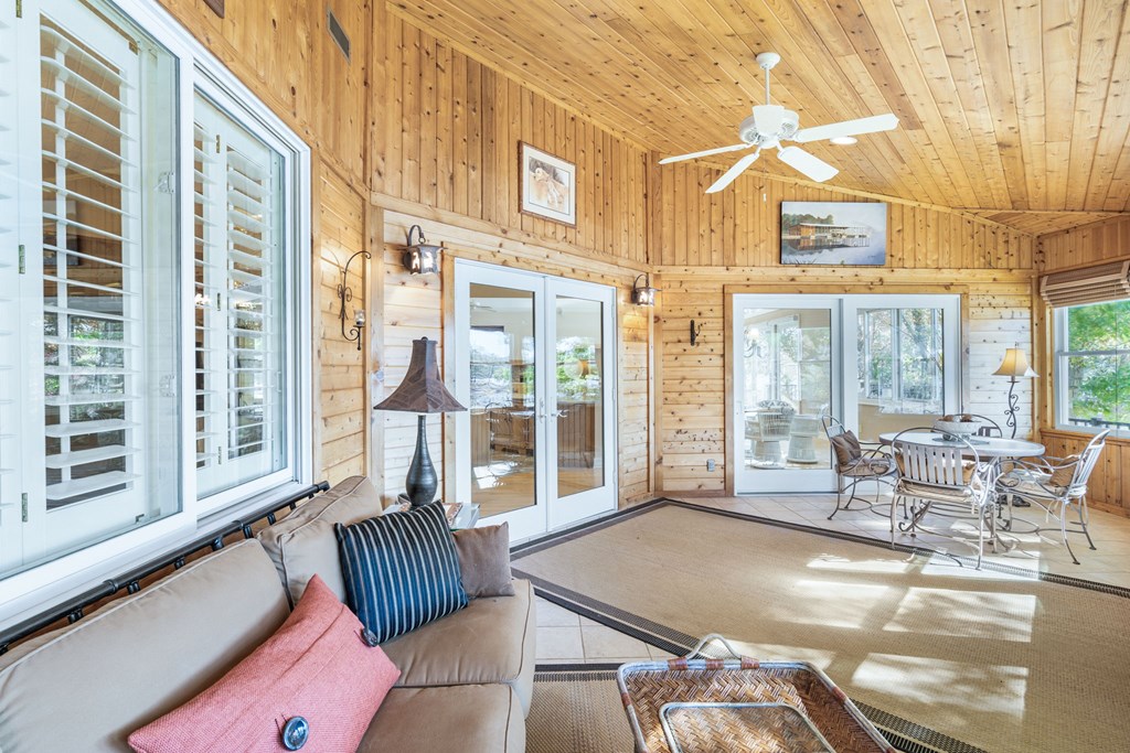 1370 Heathers Cove Circle Hiawassee, GA 30546 - Photo 23 of 99 a living room with furniture and a floor to ceiling window