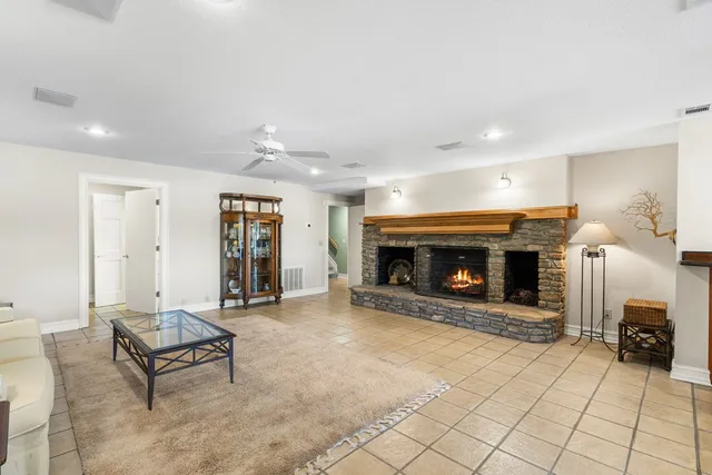 an aerial view of a house with a yard and garden