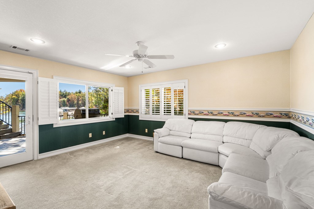 1370 Heathers Cove Circle Hiawassee, GA 30546 - Photo 41 of 99 a living room with furniture and a large window