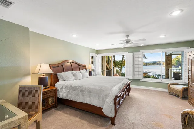 a living room with furniture and a large window with outer view