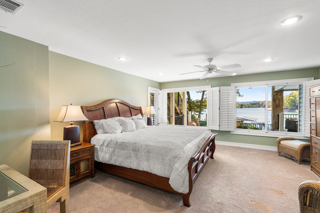 1370 Heathers Cove Circle Hiawassee, GA 30546 - Photo 42 of 99 a bedroom with a large bed and a large window