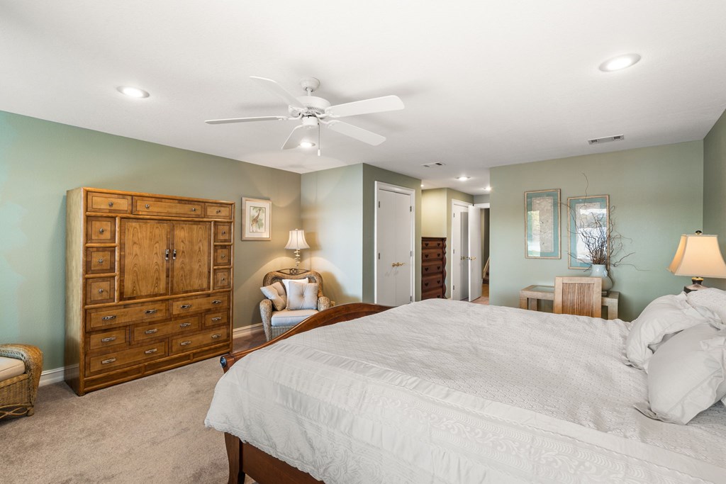 1370 Heathers Cove Circle Hiawassee, GA 30546 - Photo 43 of 99 a bedroom with a bed and a chandelier