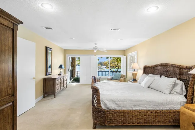a view of a patio with table and chairs with wooden floor and fence