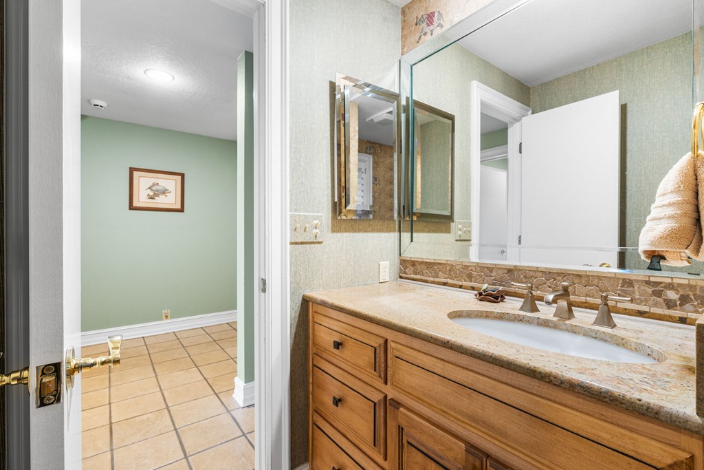1370 Heathers Cove Circle Hiawassee, GA 30546 - Photo 46 of 99 a bathroom with a sink and a mirror