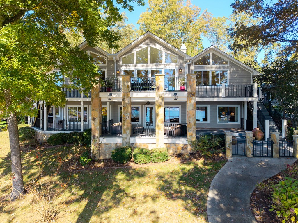 1370 Heathers Cove Circle Hiawassee, GA 30546 - Photo 56 of 99 a front view of a house with a yard table and chairs