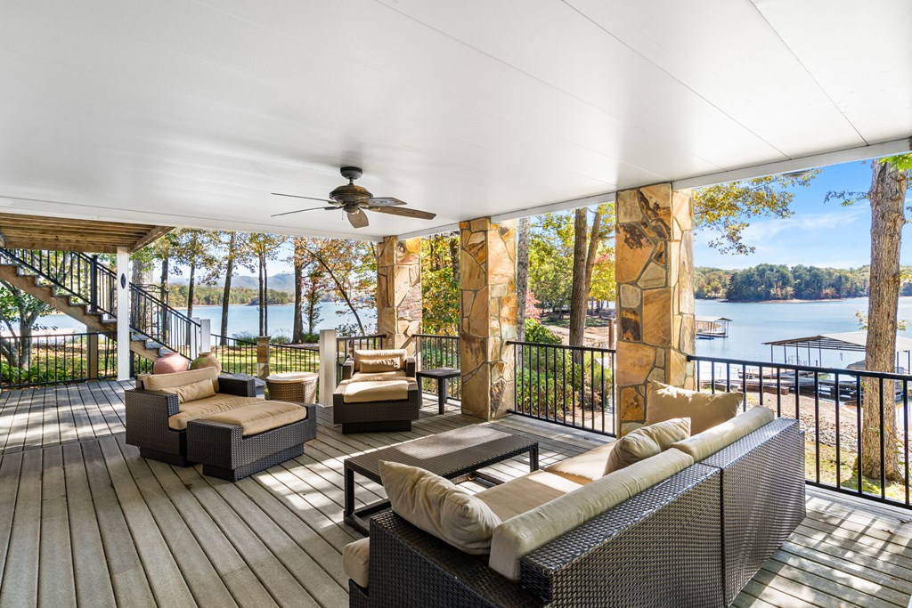 1370 Heathers Cove Circle Hiawassee, GA 30546 - Photo 58 of 99 a living room with furniture and a floor to ceiling window