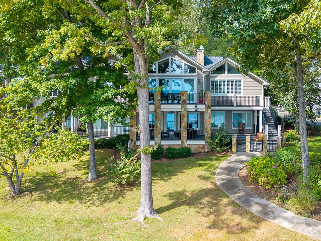 1370 Heathers Cove Circle Hiawassee, GA 30546 - Photo 82 of 99 a front view of a house with a yard table and chairs