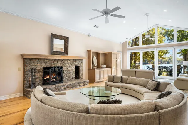a living room with furniture a window and a fireplace