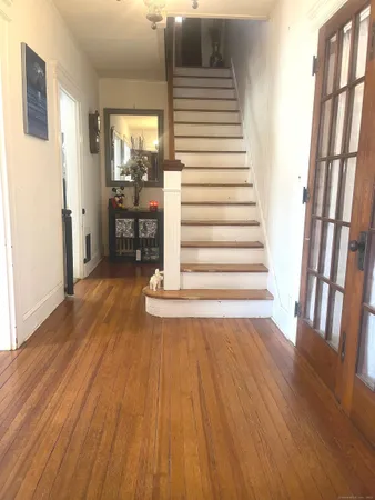 a view of entryway with wooden floor