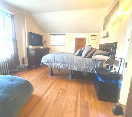 a room with furniture and a wooden floor