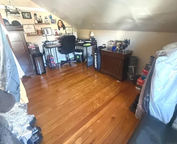 a bedroom with a bed and lamp