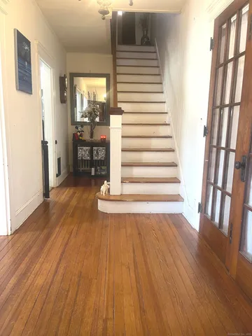 a view of entryway with wooden floor