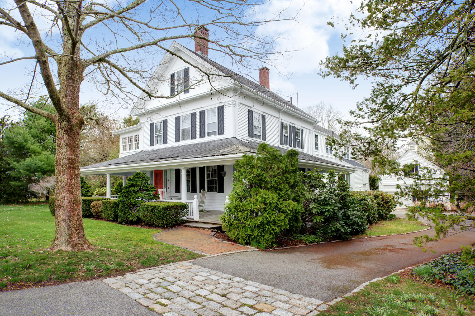 463 Main Street Centerville, MA 02632 - Photo 1 of 36 a front view of a house with a garden