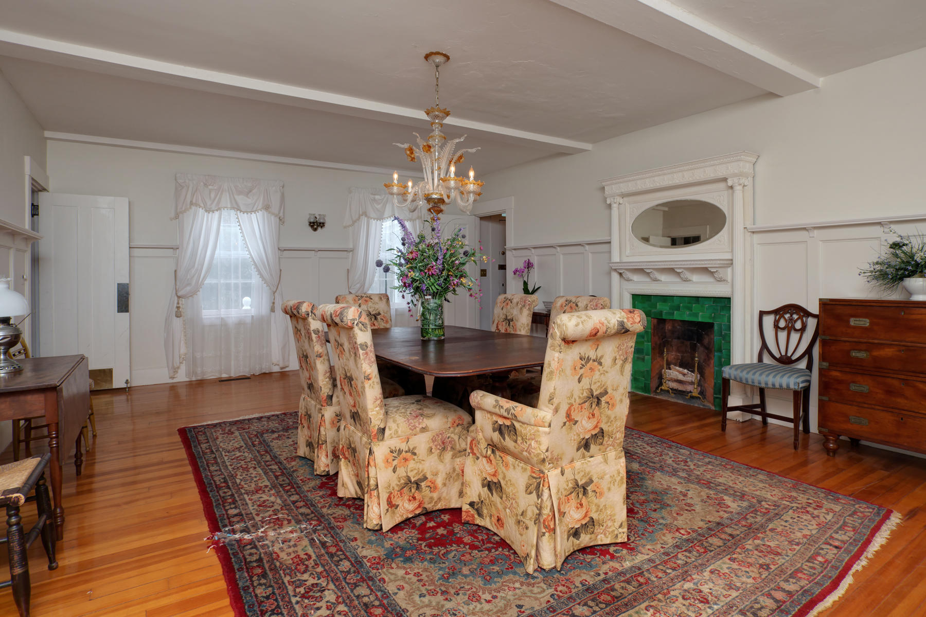 463 Main Street Centerville, MA 02632 - Photo 14 of 36 a view of a dining room with furniture and chandelier