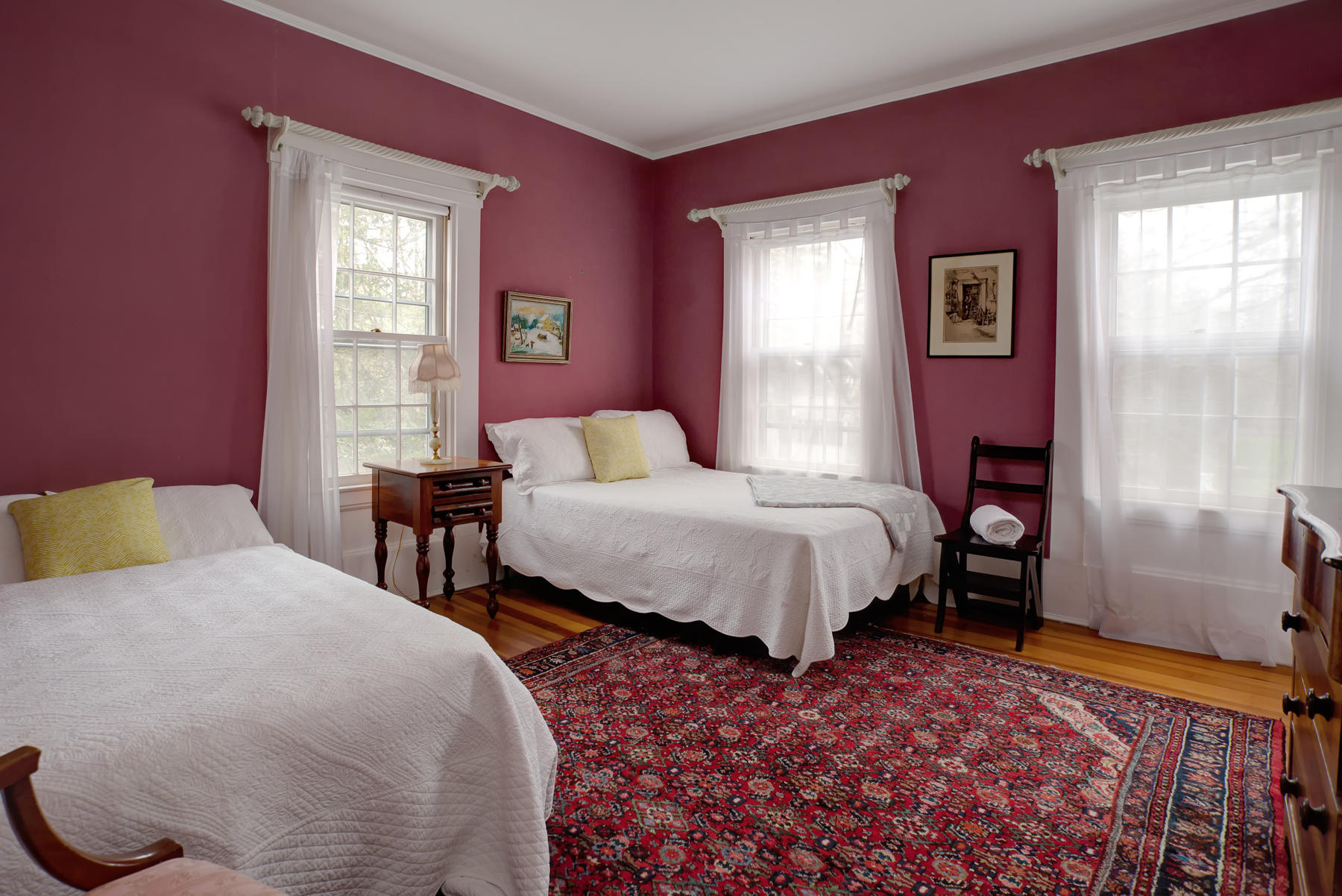 463 Main Street Centerville, MA 02632 - Photo 22 of 36 a bedroom with a bed and wooden floor