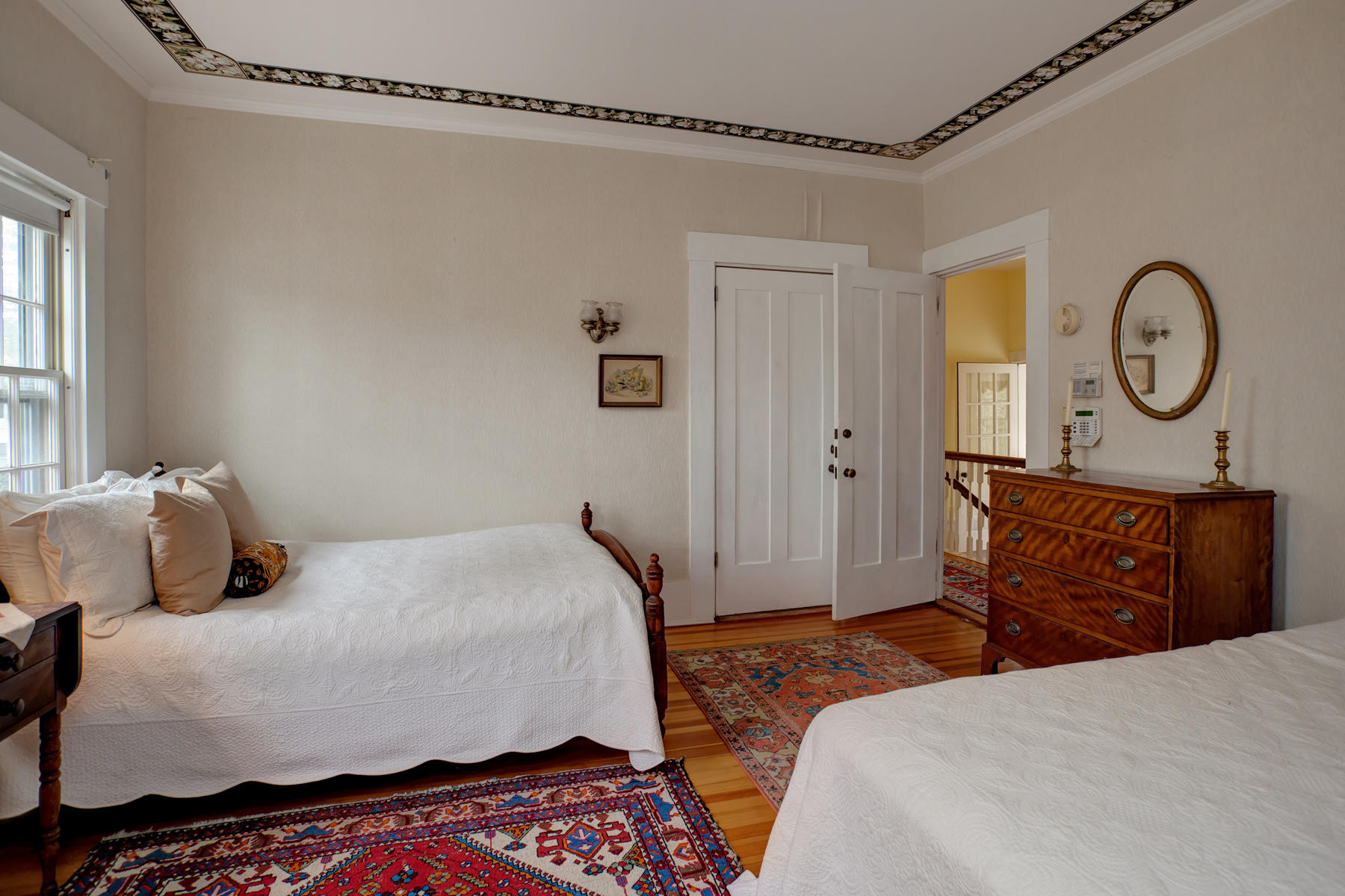 463 Main Street Centerville, MA 02632 - Photo 24 of 36 a bedroom with a bed a dresser with wooden floor