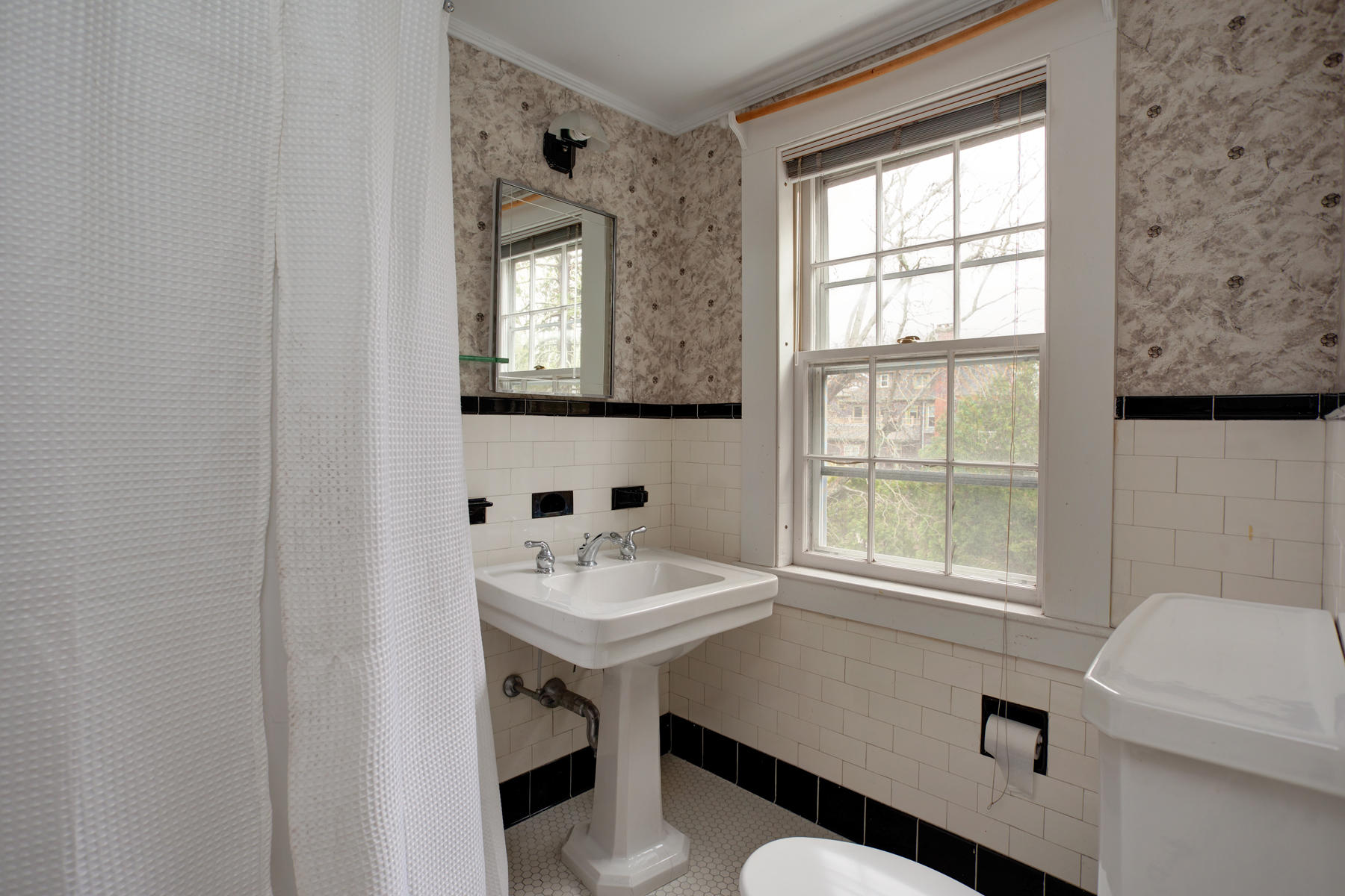 463 Main Street Centerville, MA 02632 - Photo 26 of 36 a bathroom with a sink a toilet and a window