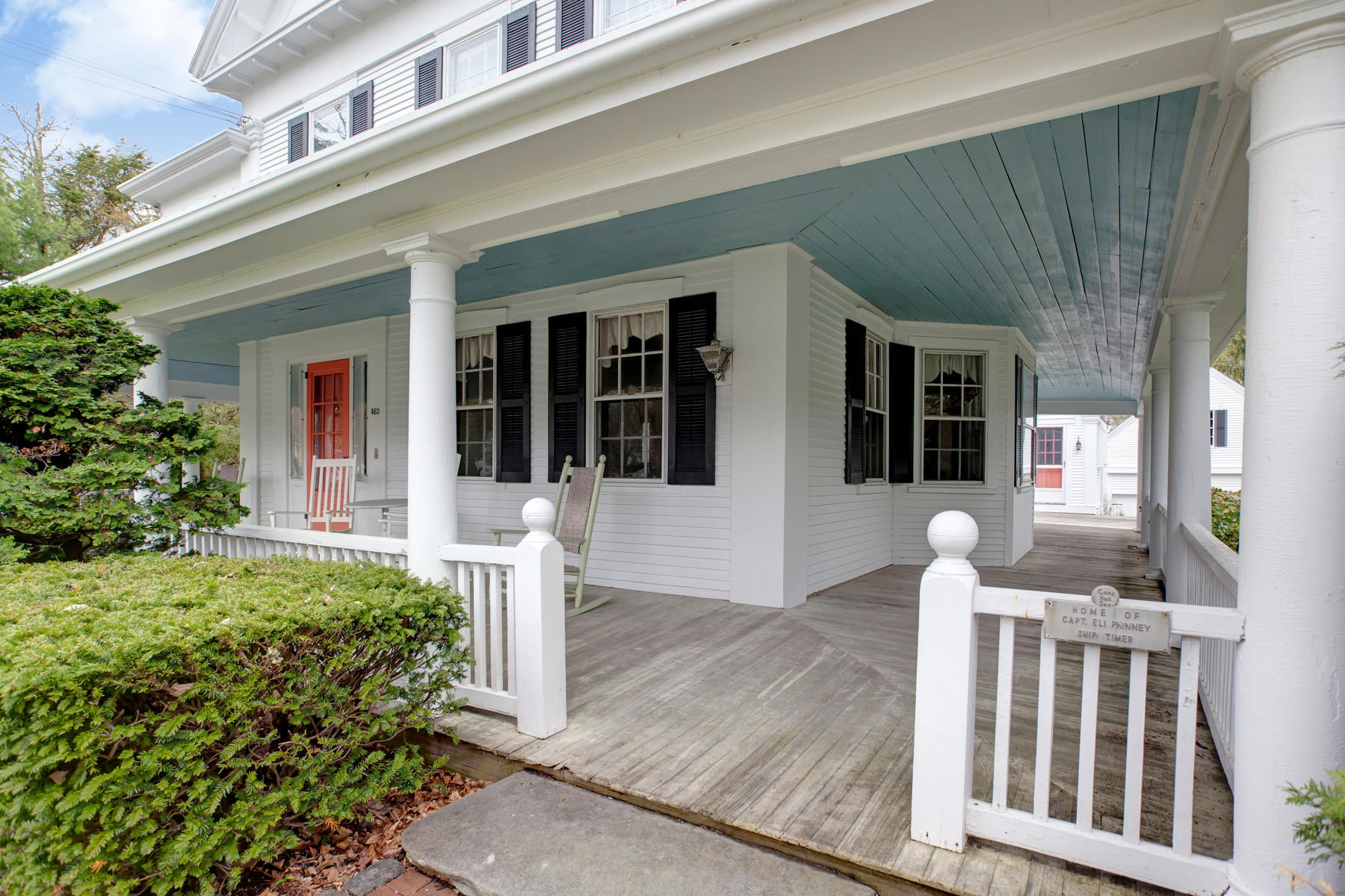 463 Main Street Centerville, MA 02632 - Photo 3 of 36 a front view of a house with outdoor seating