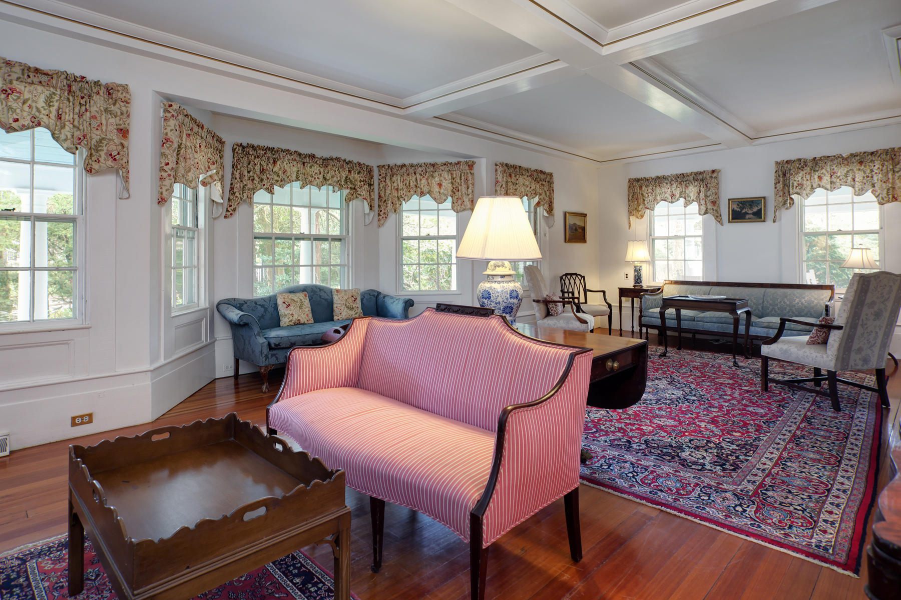 463 Main Street Centerville, MA 02632 - Photo 9 of 36 a living room with furniture a table and large windows