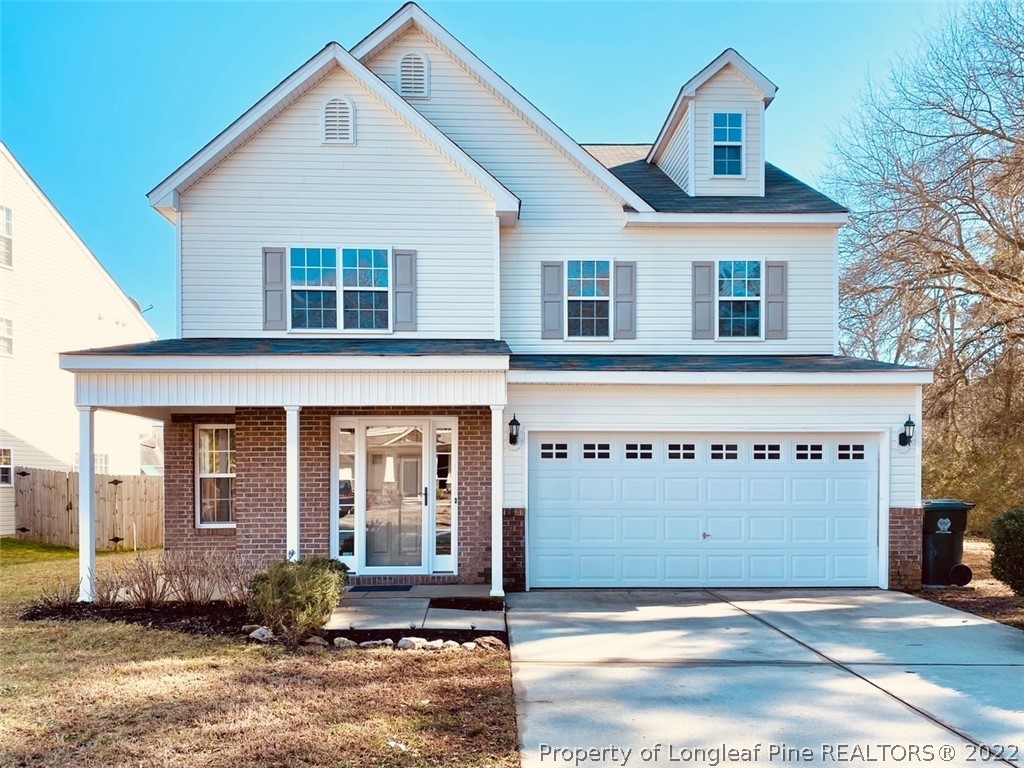 3104 Guiding Light Road Raleigh, NC 27610 - Photo 1 of 36 a front view of a house with a garden