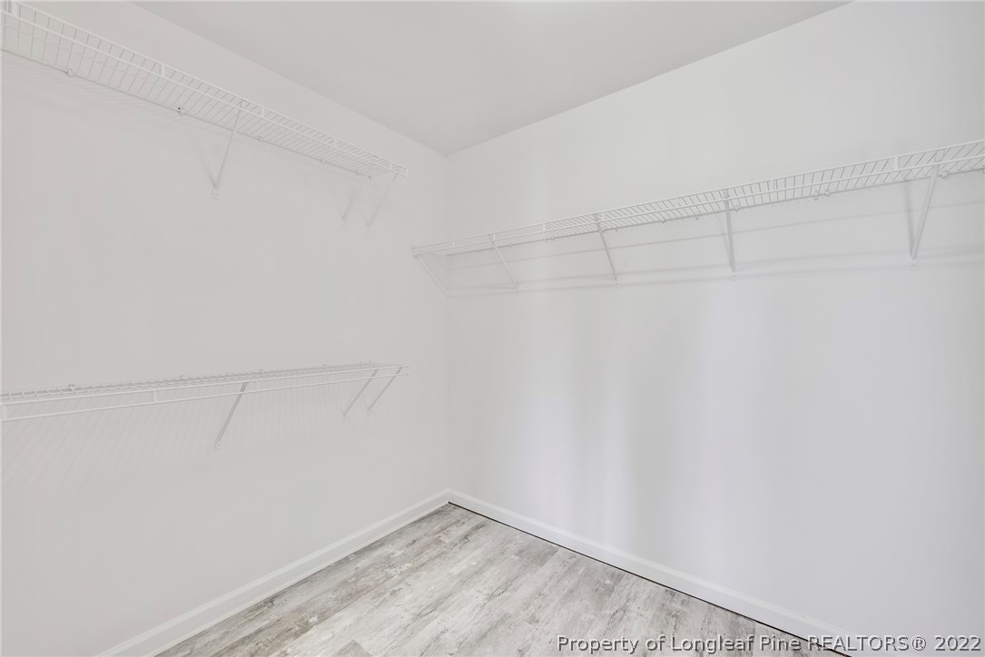 3104 Guiding Light Road Raleigh, NC 27610 - Photo 23 of 36 a view of a room with racks on the wall