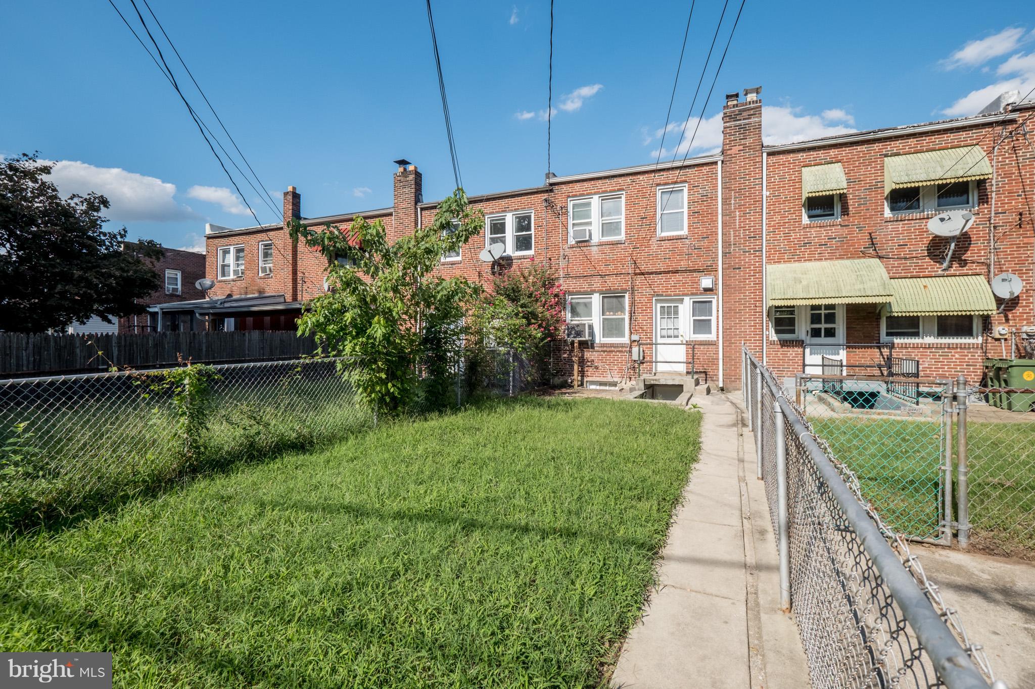 161 West Meadow Road Baltimore, MD 21225 - Photo 22 of 24 a front view of a house with a yard