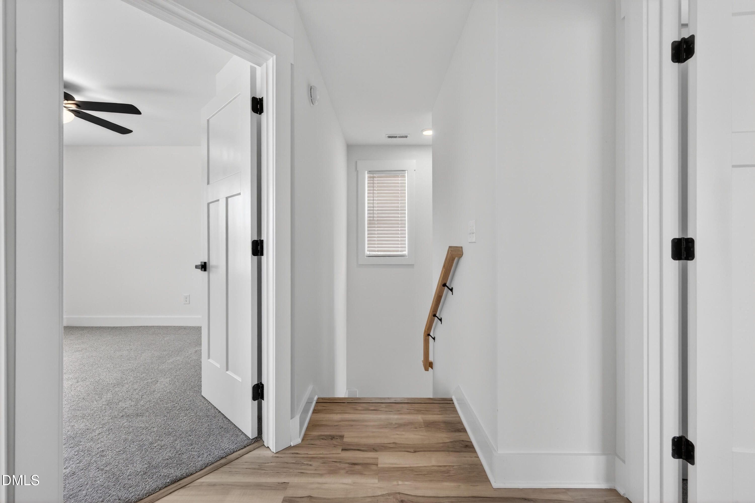 1182 Hurdle Mills Road Roxboro, NC 27573 - Photo 22 of 45 a view of a hallway with wooden floor and staircase