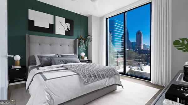 a bedroom with a large bed and a window