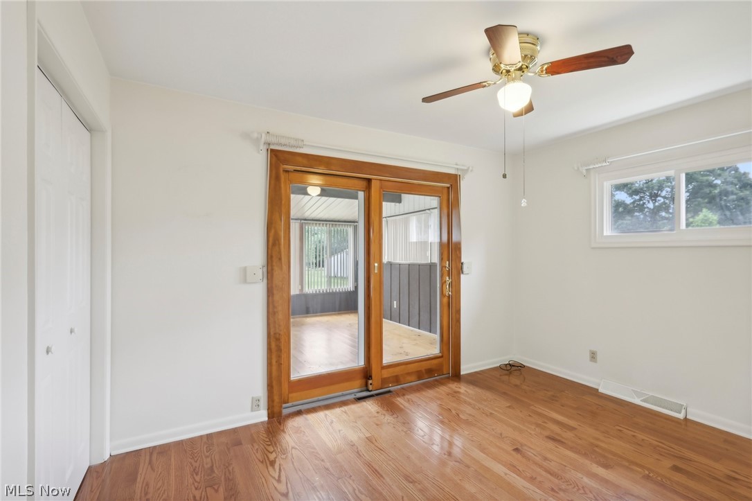 3873 Baumberger Road Stow, OH 44224 - Photo 22 of 50 Bedroom featuring a wealth of natural light, light wood-type flooring, and ceiling fan