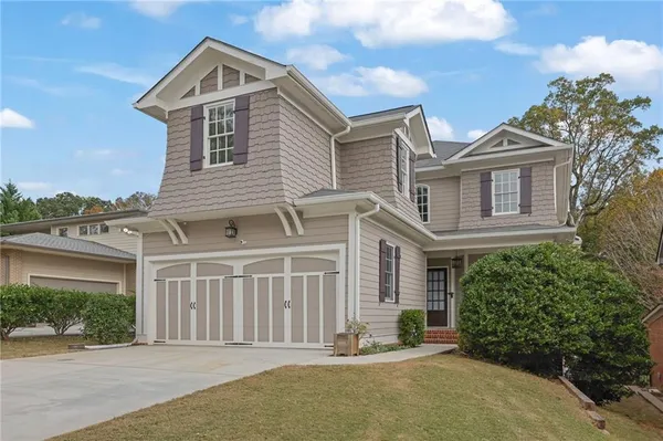 a front view of a house with a garage