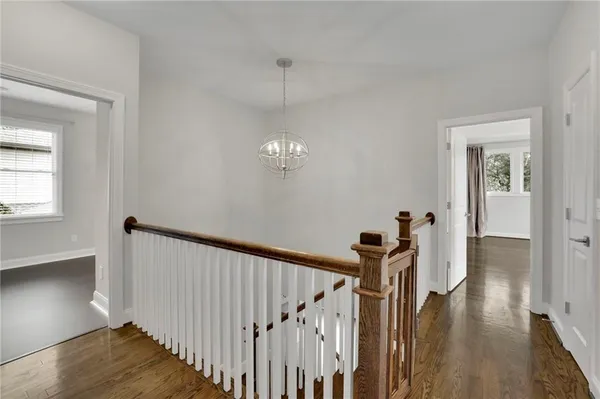 a view of a hallway with a chandelier