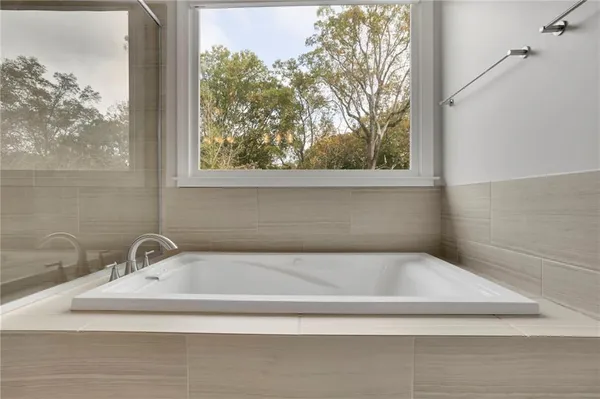 a white bath tub sitting in a bathroom