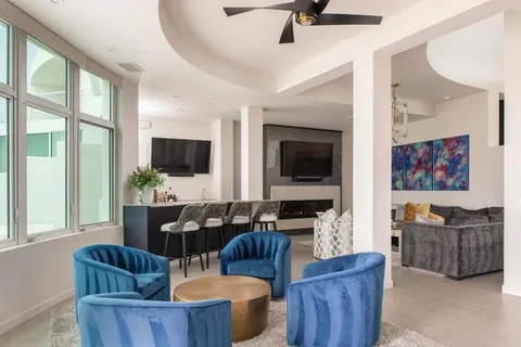 a living room with furniture and a flat screen tv