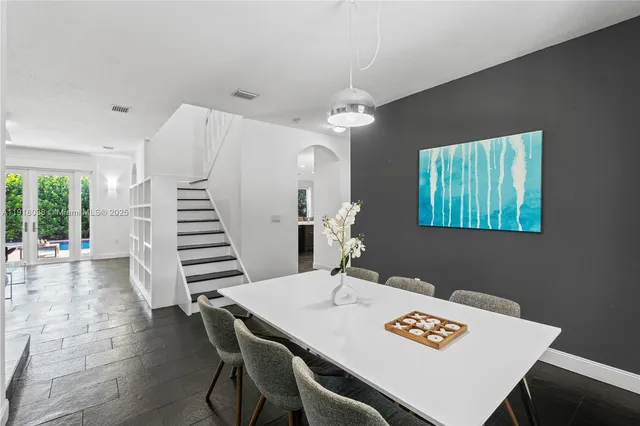 a kitchen with a sink appliances and cabinets