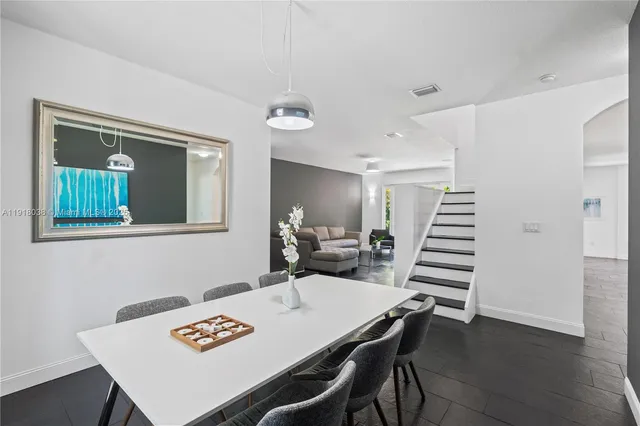 a kitchen with granite countertop stainless steel appliances and wooden cabinets