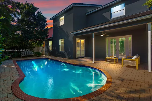 a view of a house with swimming pool