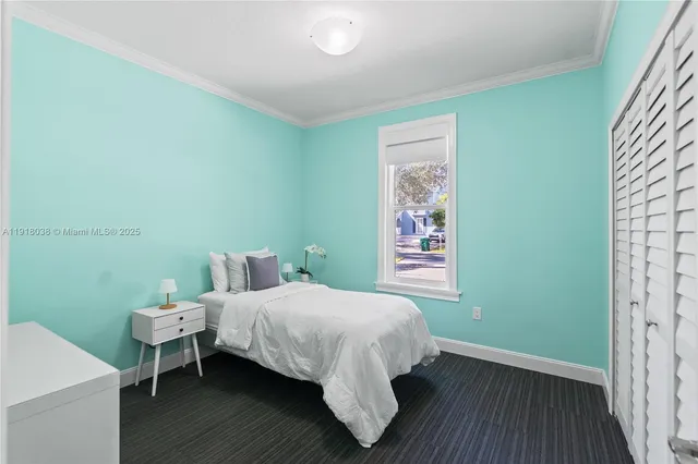 a bed room with a bed and a table