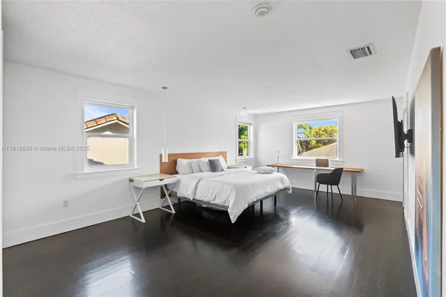 a bathroom with double vanity sink and a mirror