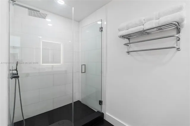 a bathroom with a sink toilet and a mirror