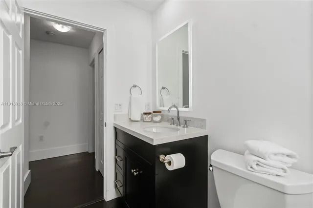 a bedroom with bed and glass window