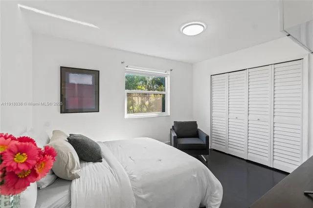 a view of swimming pool with a lounge chairs