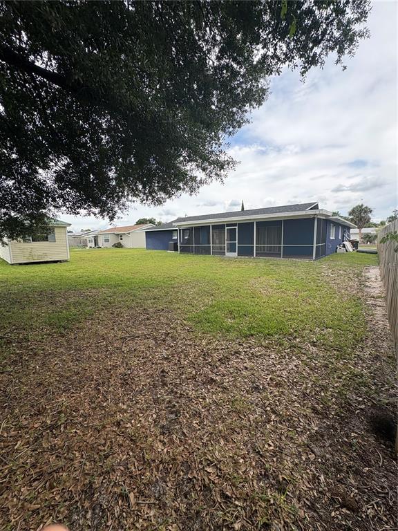 4027 Bianca Street Sebring, FL 33872 - Photo 19 of 22 a view of a house with a yard