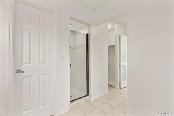 a view of a bathroom with shower