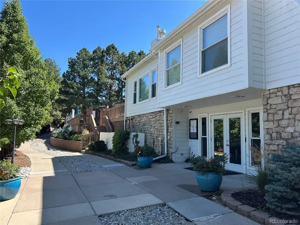 a view of a patio with a chairs and table in a patio