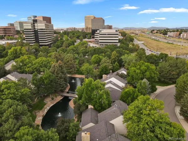 an aerial view of city and lake