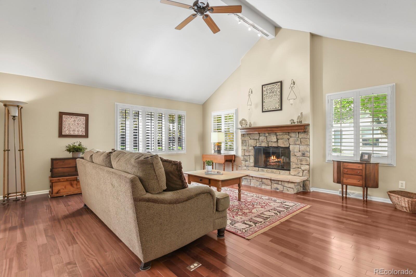 4530 South Verbena Street, Unit 309 Denver, CO 80237 - Photo 7 of 45 a living room with furniture and a fireplace
